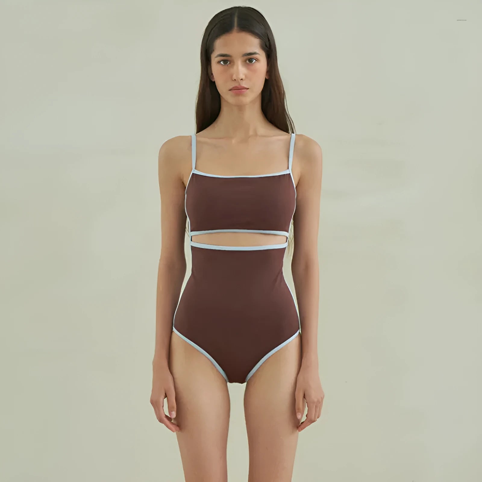 Brown triangle cut one-piece swimsuit for women on hanger showing front design