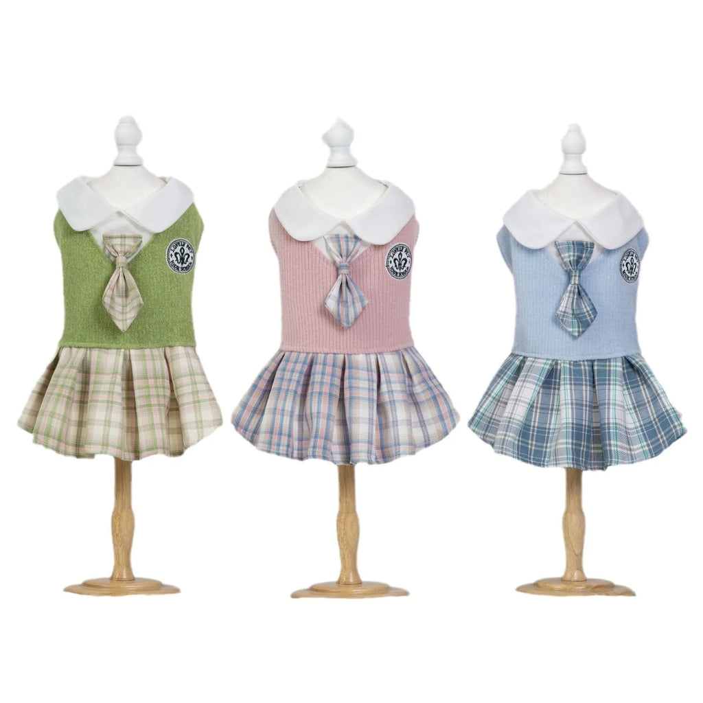 A pink tartan skirt with princess styling designed for a small dog to wear.