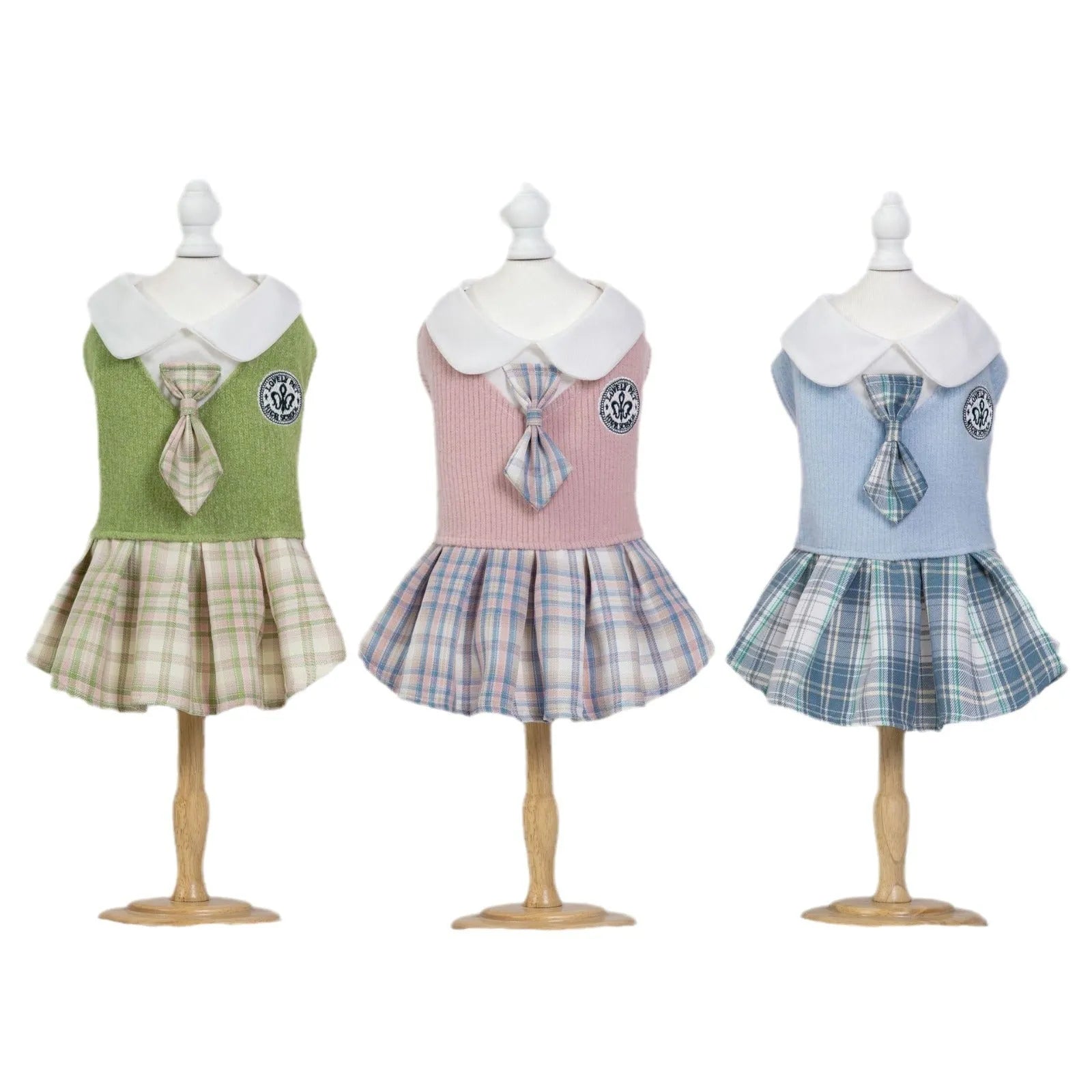 A pink tartan skirt with princess styling designed for a small dog to wear.