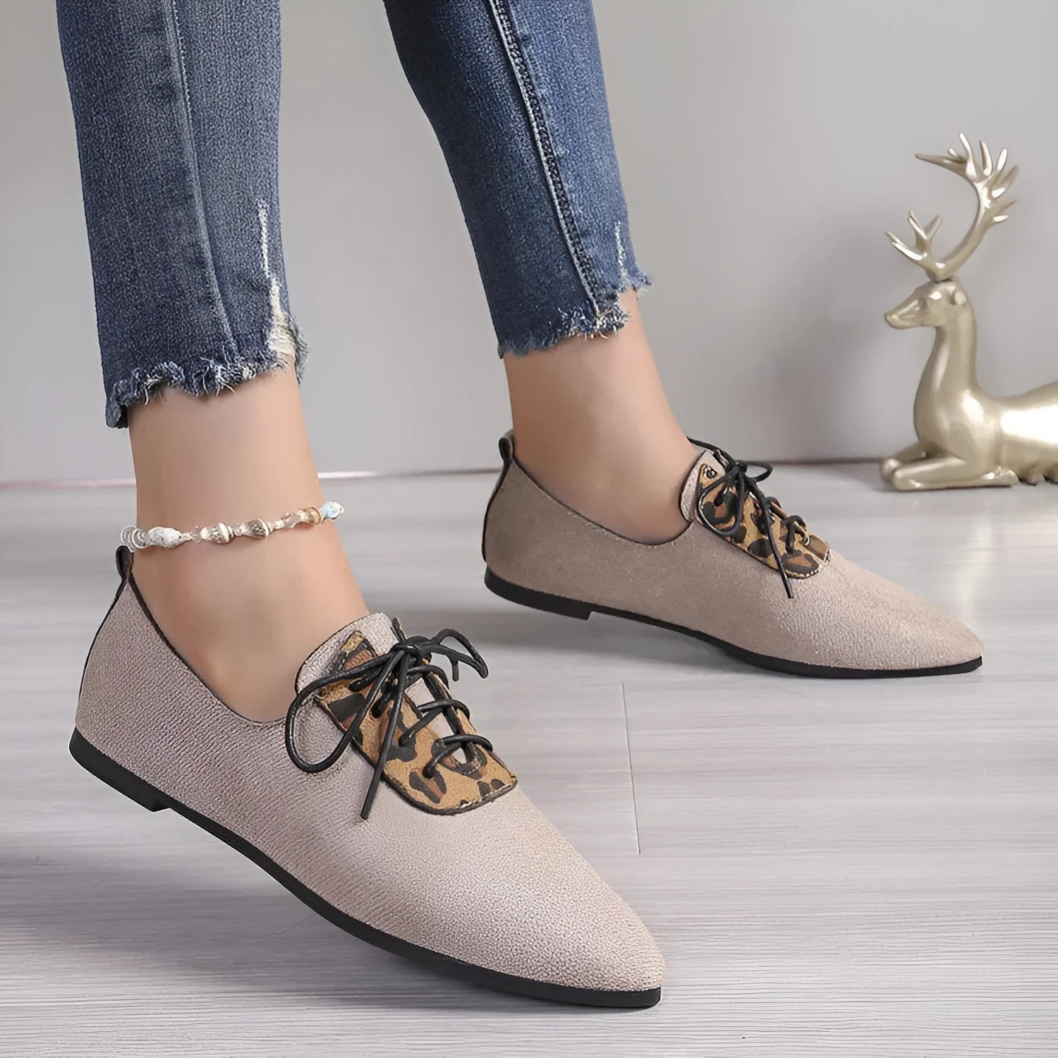 Beige leopard print pointed toe pumps for women in plus sizes, shown on a white background.
