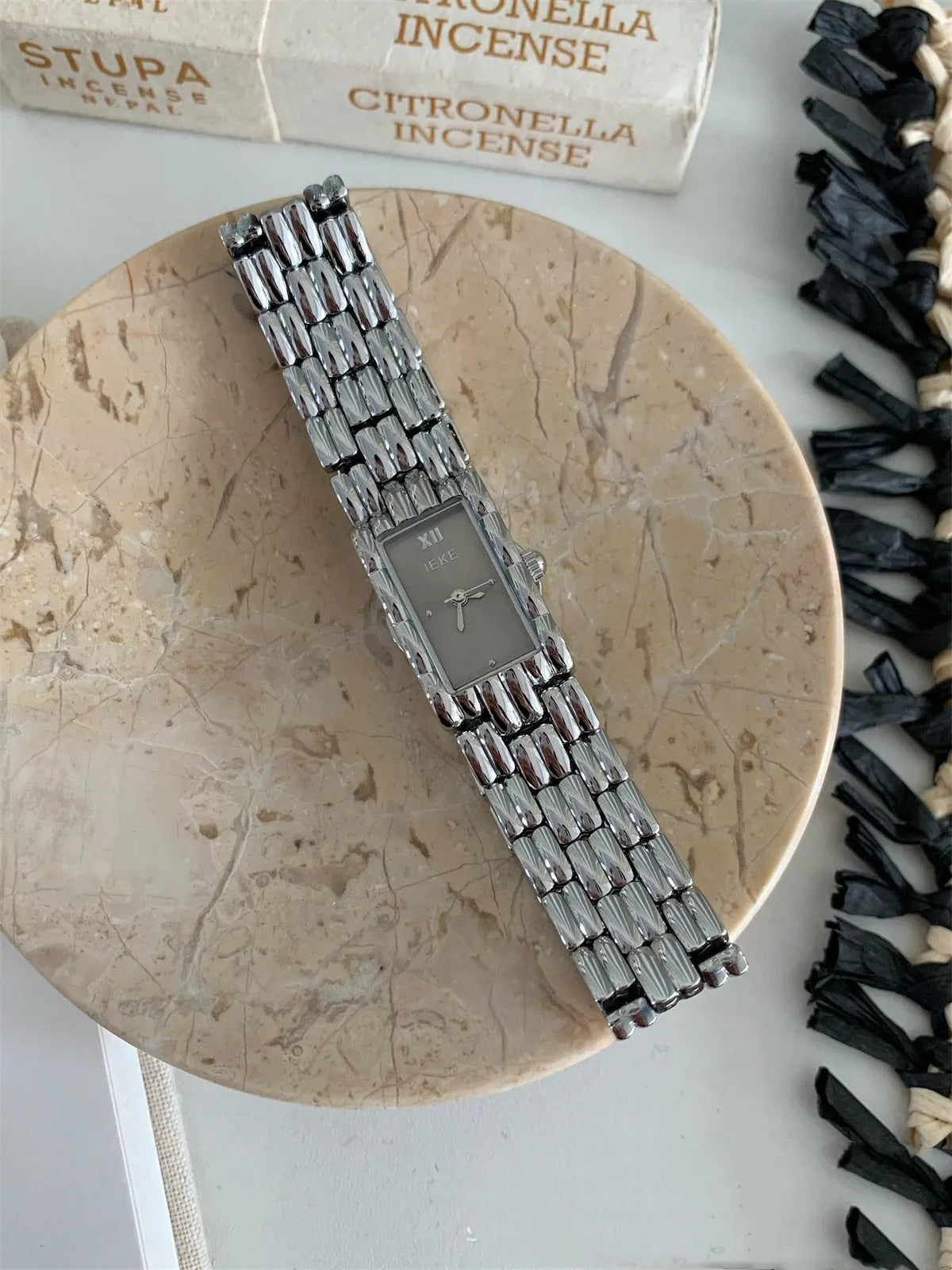 Women's bracelet watch with 15mm dial, spiral crown, and stainless steel strap in gold or silver finish