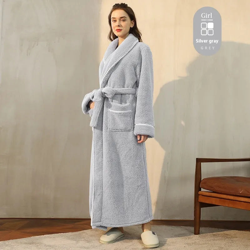 Man and woman wearing a matching thick flannel couple's bathrobe set in a winter colour.