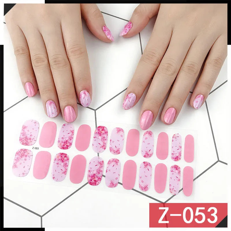 Pack of Korean nail stickers showing cartoon, strawberry, flower, and shell designs with a nail file.