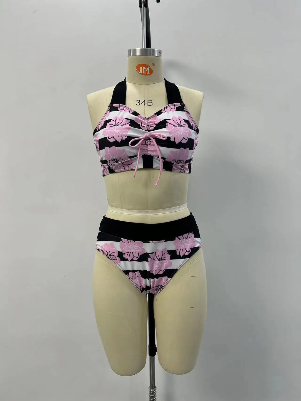 Black women's printed bikini set with belly-covered slimming design for swimming.