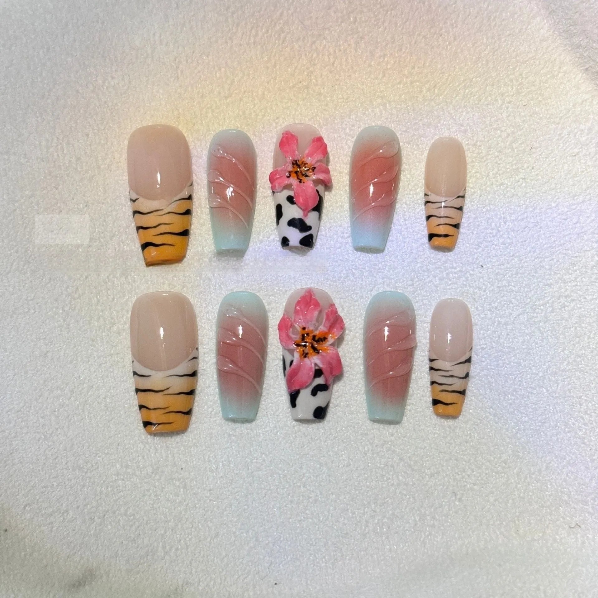 Lily and zebra pattern hand-carved press-on nail art set in a long, wear-resistant style.