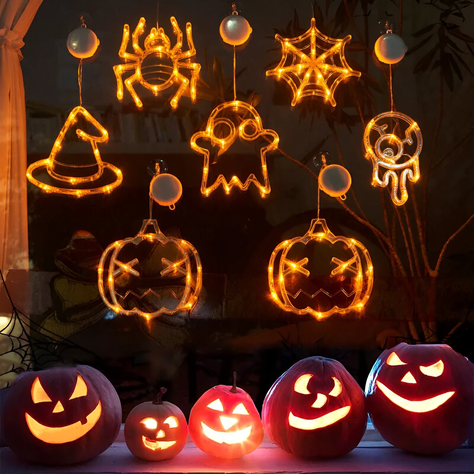 Halloween window hanging LED lights 7-piece set with spider pumpkin ghost designs on display