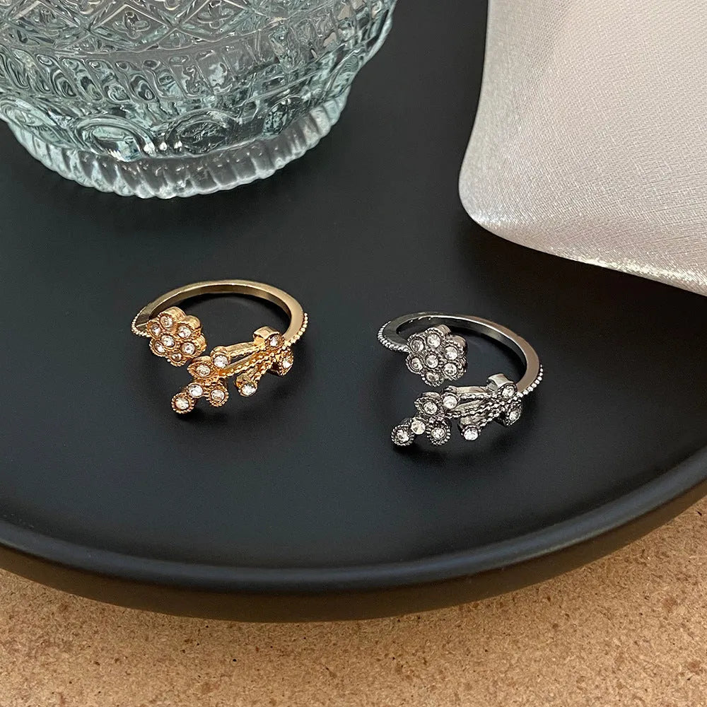Women's open ring with diamond flower leaves design in copper, gold or white colour options