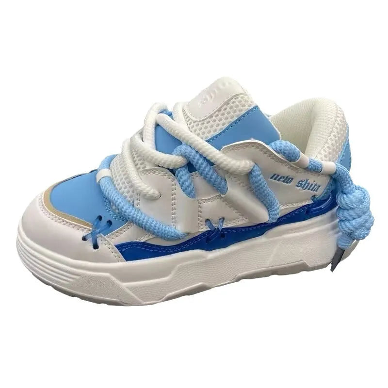 Women's grey retro chunky sneakers with thick rubber sole and high heel on a plain background