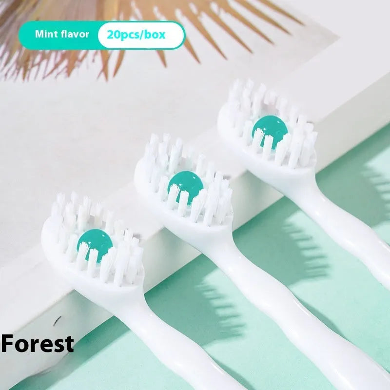 Box containing 20 individual pre-pasted bead toothbrushes for travel, shown with mint, peach, and green tea flavour options.