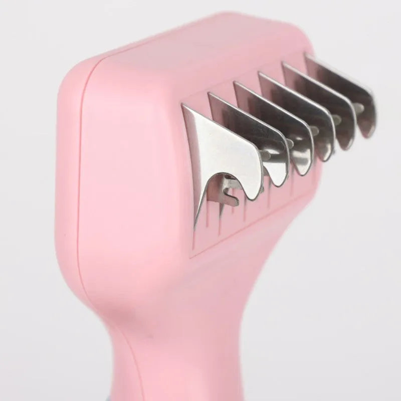 Stainless steel dog comb and knot knife set with massage brush on a pink background