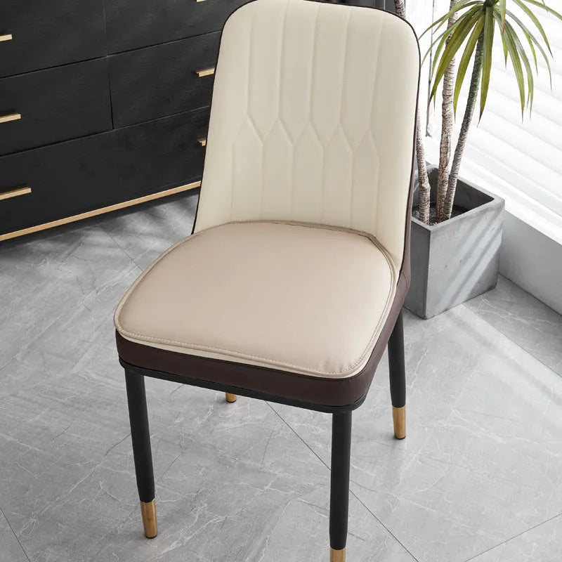 Leather horseshoe-shaped seat cushion shown in beige colour with non-slip base