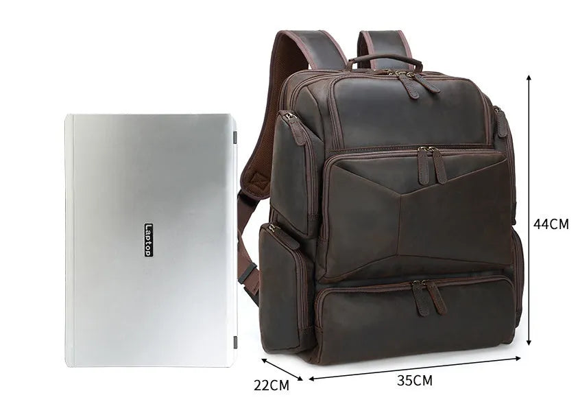 Dark brown genuine leather 17-inch laptop backpack with double straps and multiple pockets.