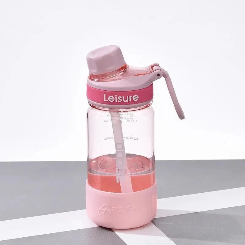 Grey plastic cup with integrated straw showing cylindrical shape and 1000ml capacity marking