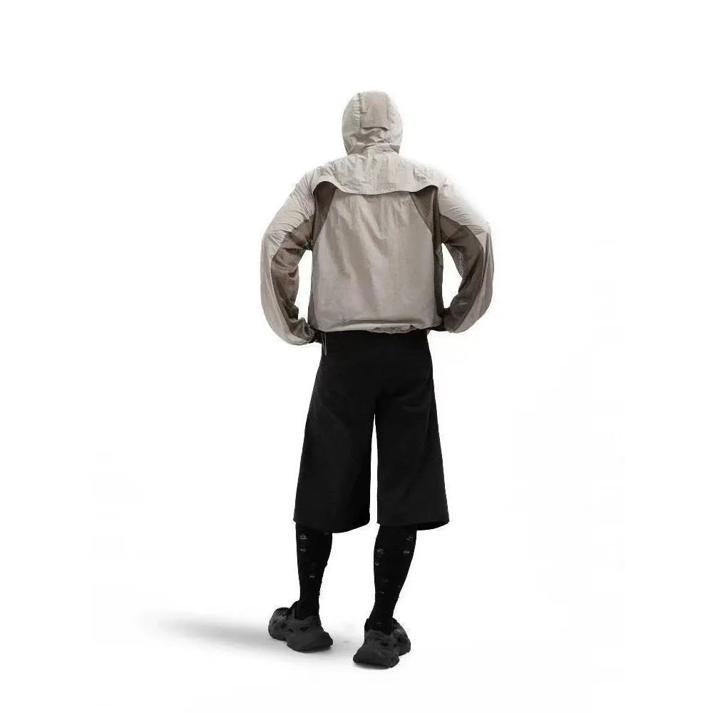 Nylon sun protective clothes with mesh stitching in desert brown, light grey, red, and blue colours.