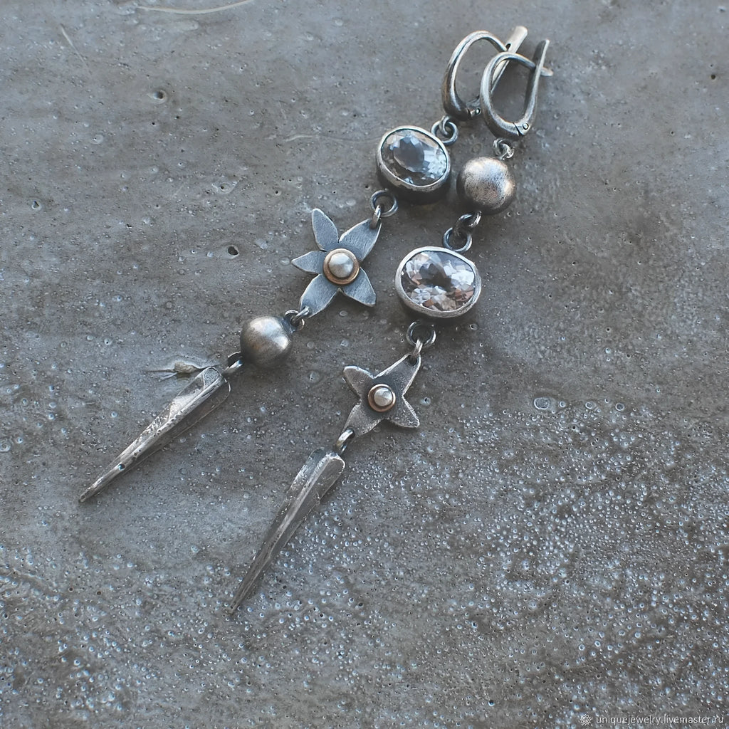 Geometric XINGX pendant earrings with antique silver finish and rhinestone detailing
