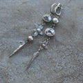 Geometric XINGX pendant earrings with antique silver finish and rhinestone detailing