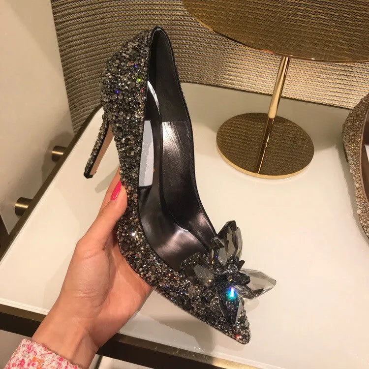 Women's gold high heels with pointed toe, rhinestone decoration, and stiletto heel