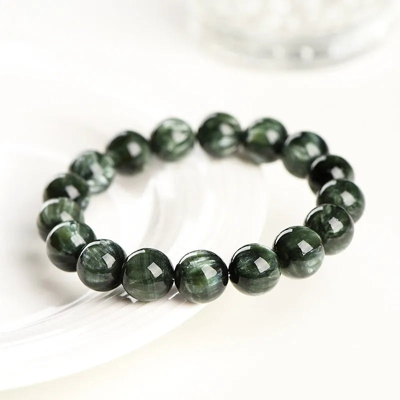 Green Dragon Crystal bracelet with 8-9mm round beads and Ruyi design on a single ring.