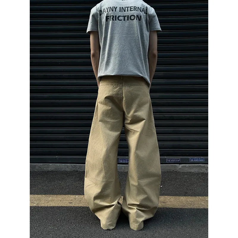 Men's khaki straight-leg cotton trousers laid flat, showing casual American retro style.