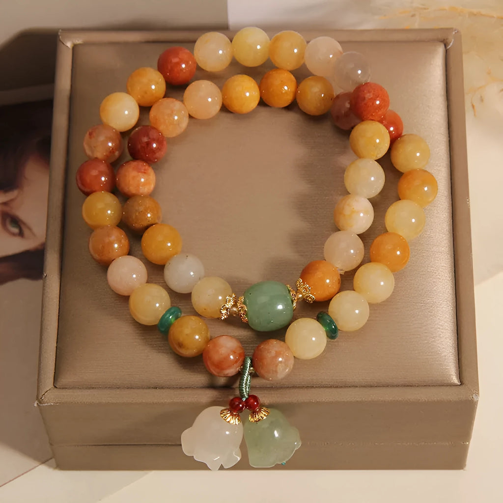 Women's natural jade multi-layer bracelet with orchid pendant detailing and jinsi construction