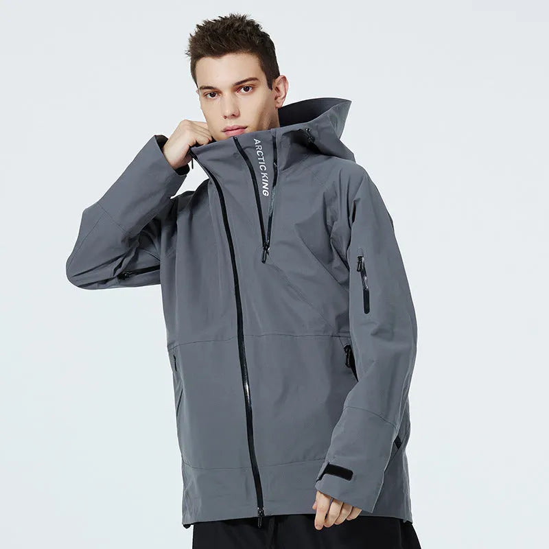 A unisex thin ski suit in yellow, shown on a model, designed for windproof and waterproof winter sports.