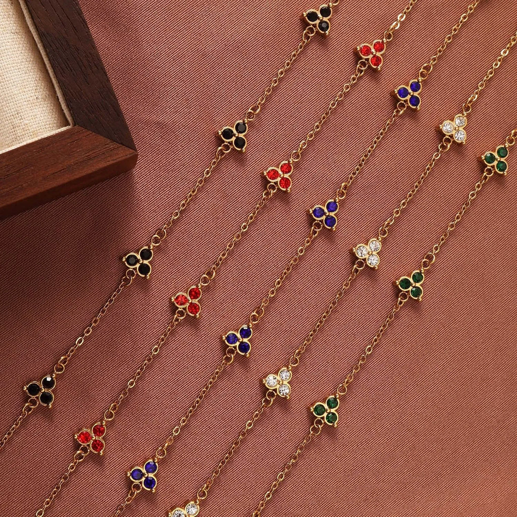 Women's stainless steel geometric bracelet with triangle design and coloured zircon stones.