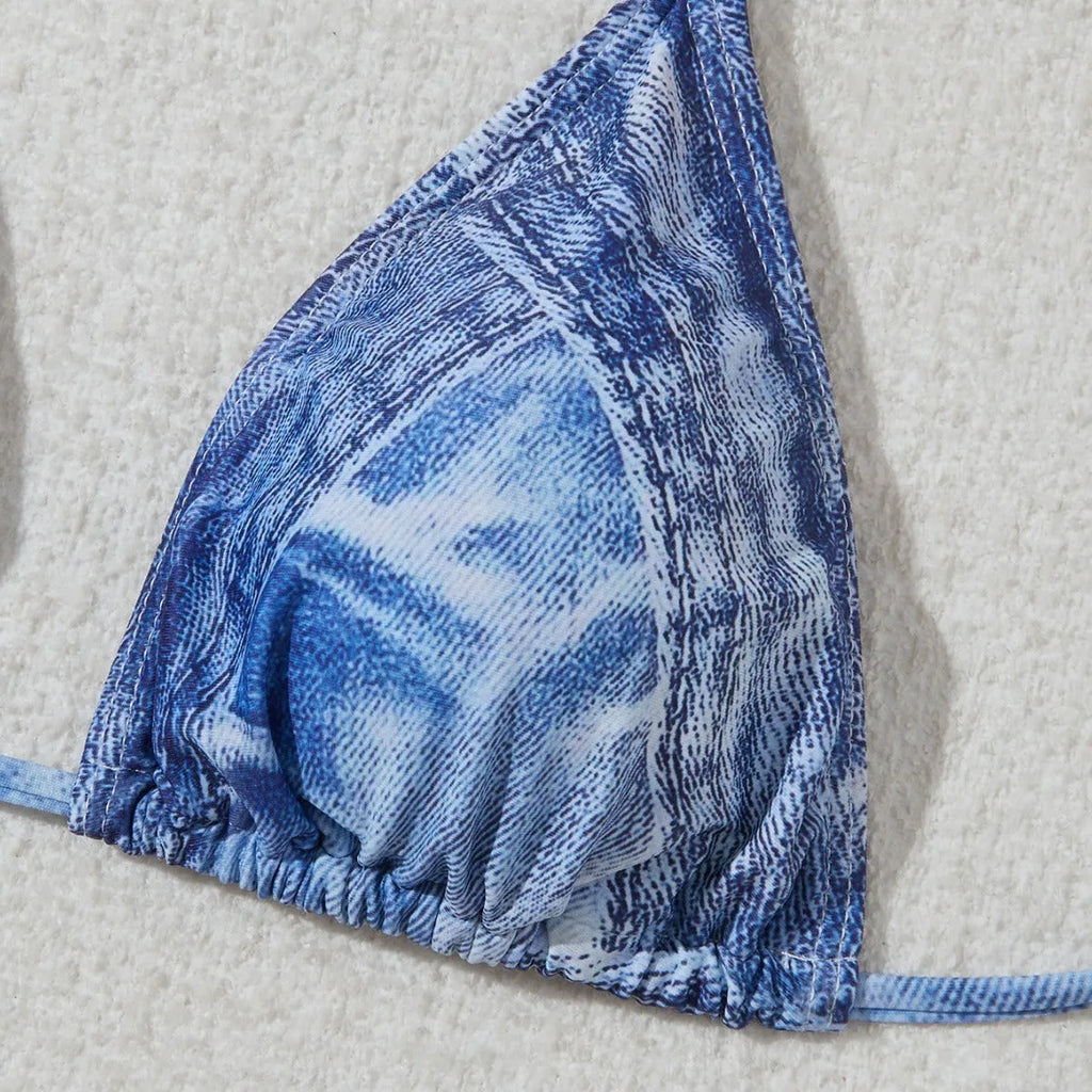 Women's denim blue strappy bikini set with printed design and two-piece swimwear construction