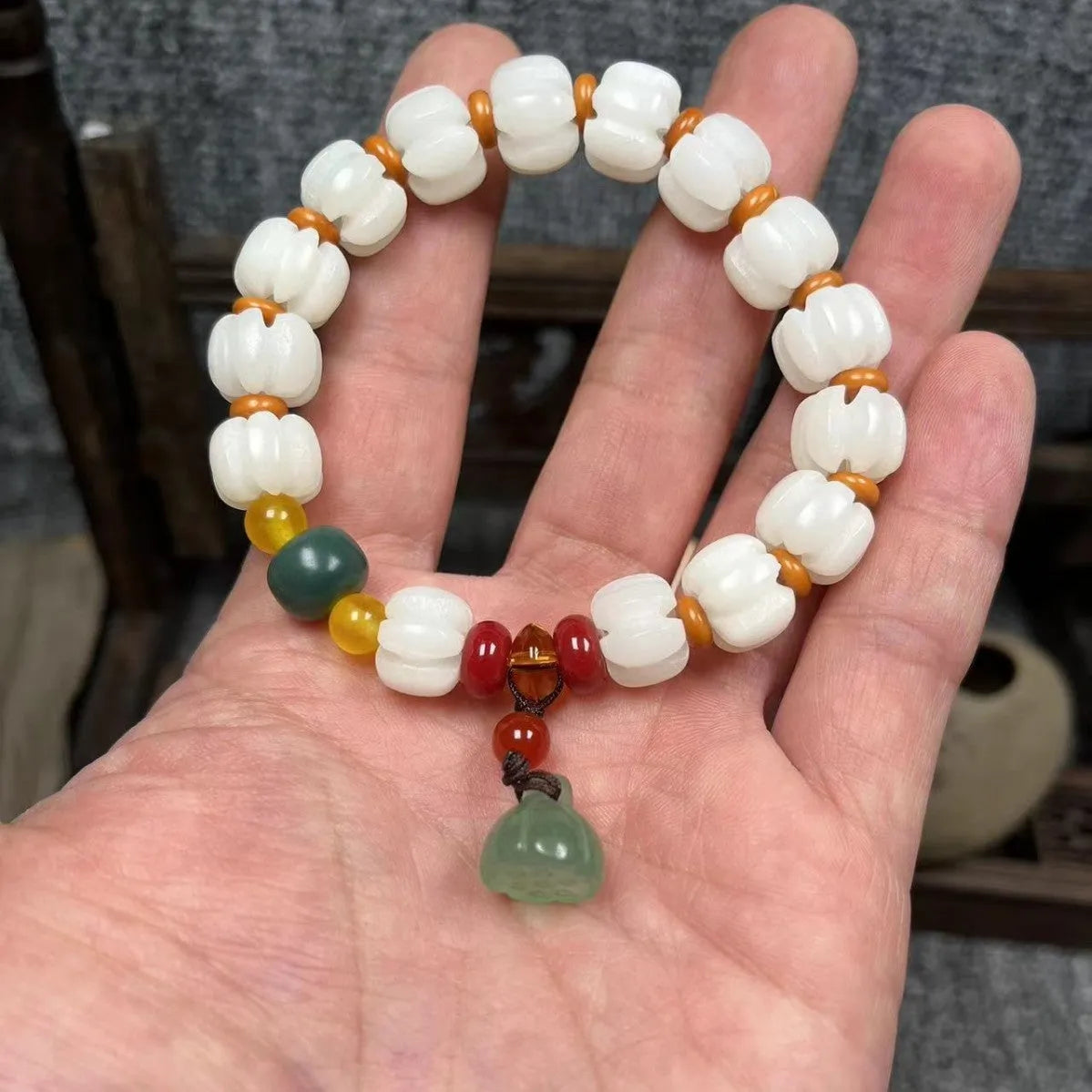 Carved pumpkin lotus Bodhi root bracelet with white jade beads and multiple dimensions