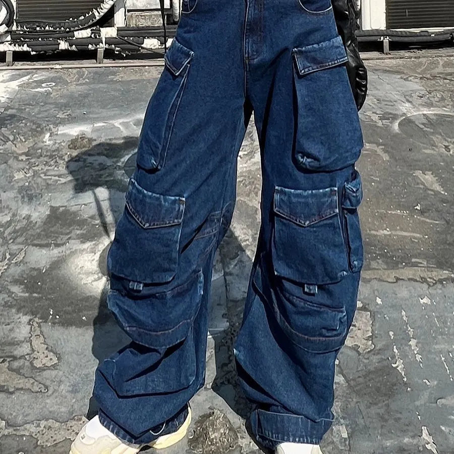 Dark blue distressed wide-leg denim jeans with high waist and multiple pockets laid flat.