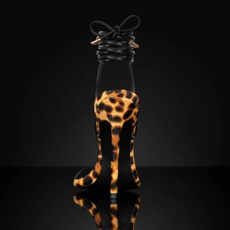 Women's leopard print pointed toe sandals with Roman lace-up straps and buckle fastening.