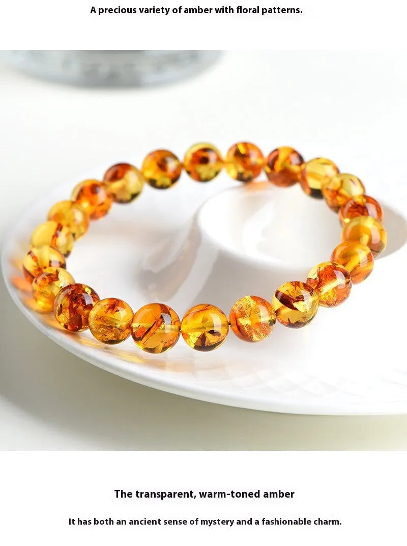 Natural yellow piebald amber bracelet with flower spot patterning in three bead size options