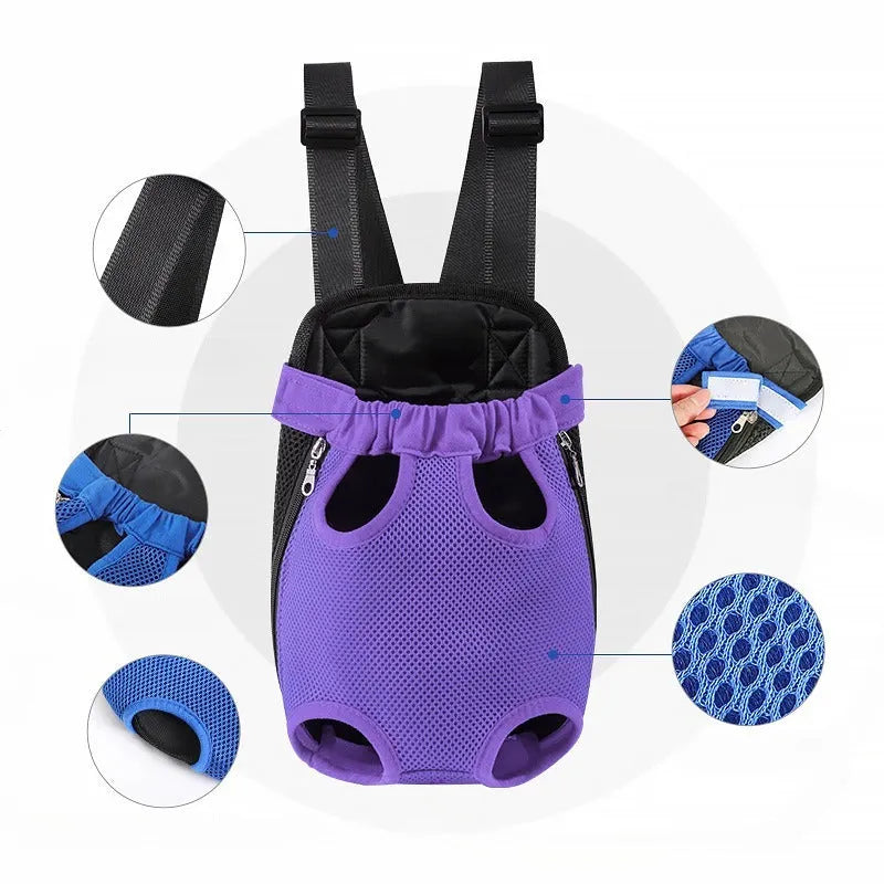 A person wearing a black nylon dog carrier backpack on their chest, with a small dog inside looking out.