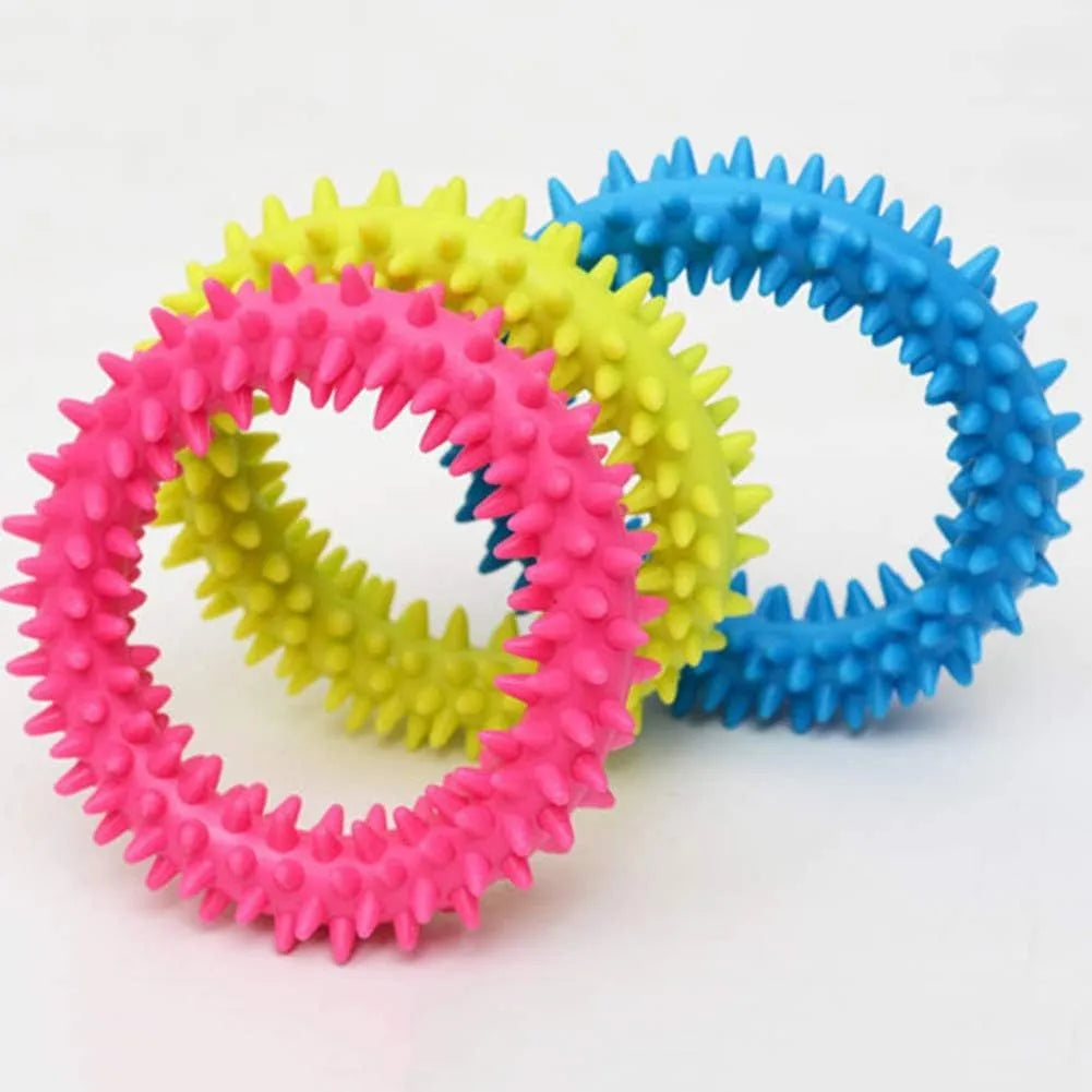 Blue TPR spiky circle dog chew toy on a white background showing dental nubs and ring shape.