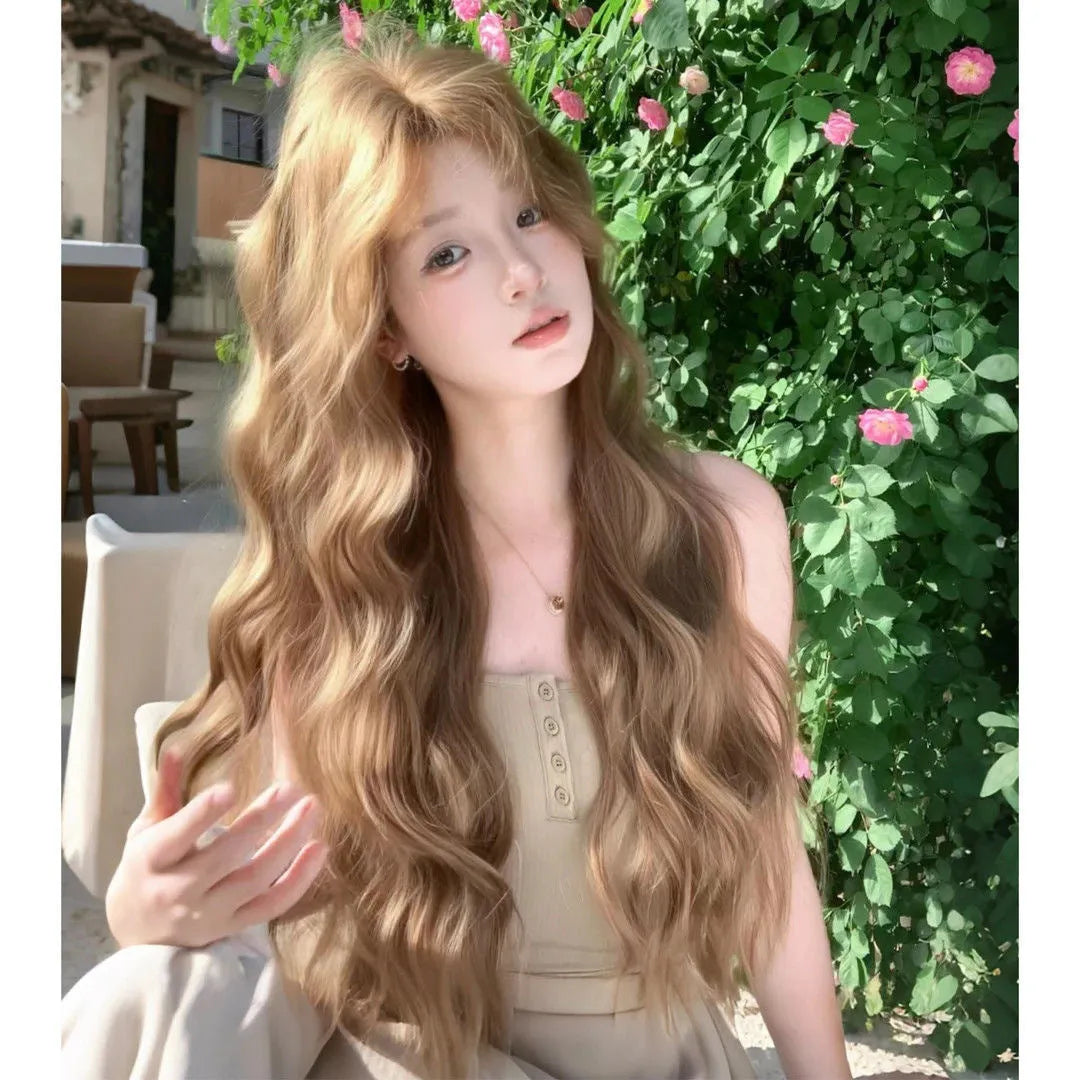 Medium-sized synthetic wig with long curly hair in a linen brown colour, shown with an attached hair net.
