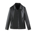 Men's solid black PU leather casual jacket with zipper pockets on a model.