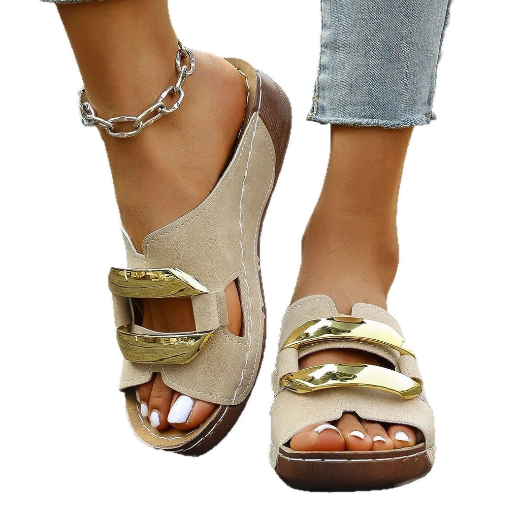 Roman style flat platform sandals in white, black, khaki, and sea blue with a metal detail and rubber sole.