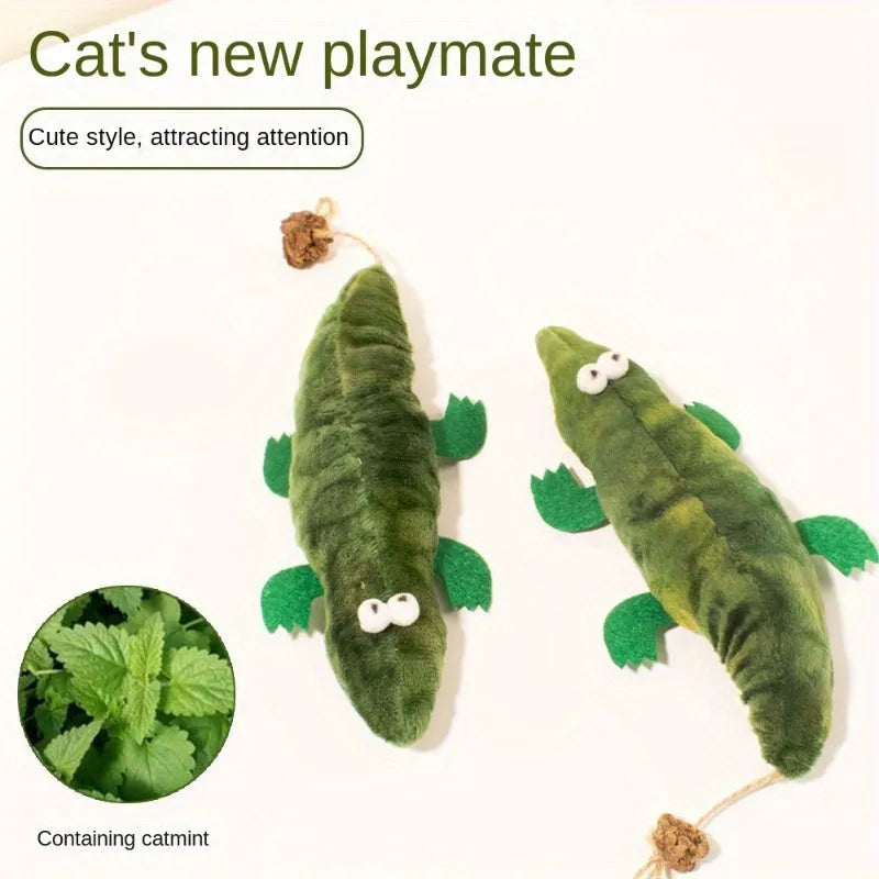 Green plush alligator cat toy with a textured reptilian design on a white background.