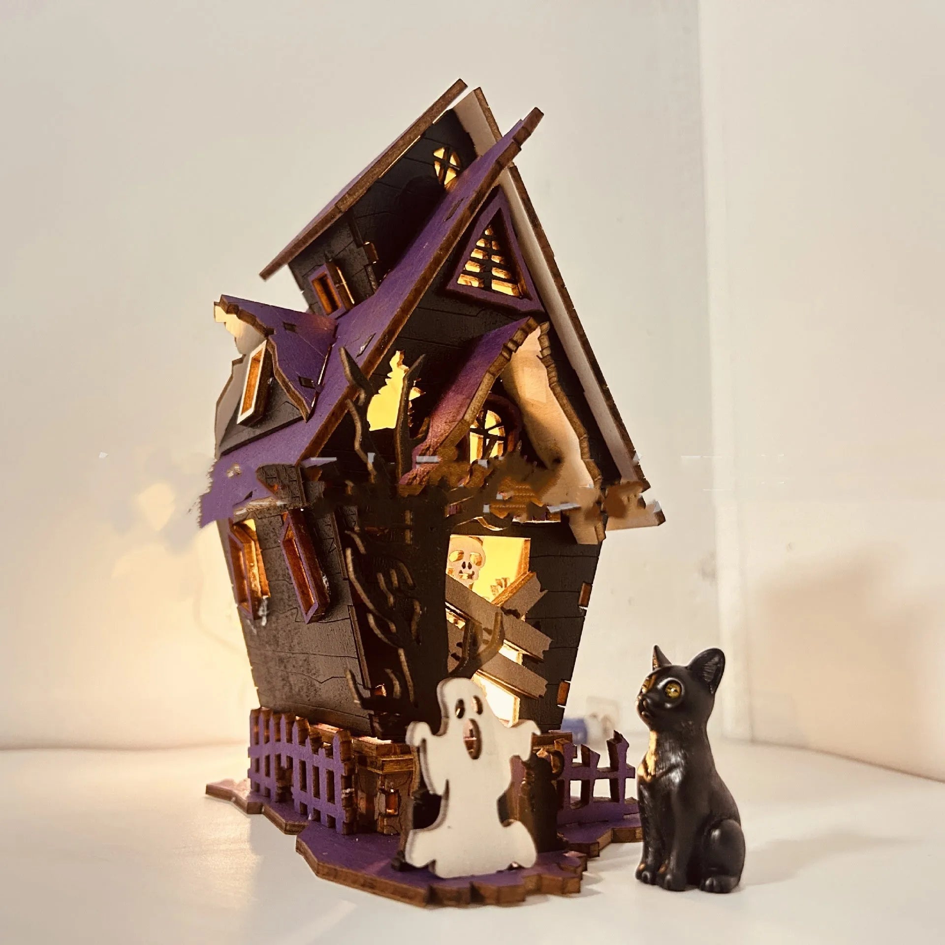 Wooden Halloween haunted house decoration with luminous finish on tabletop