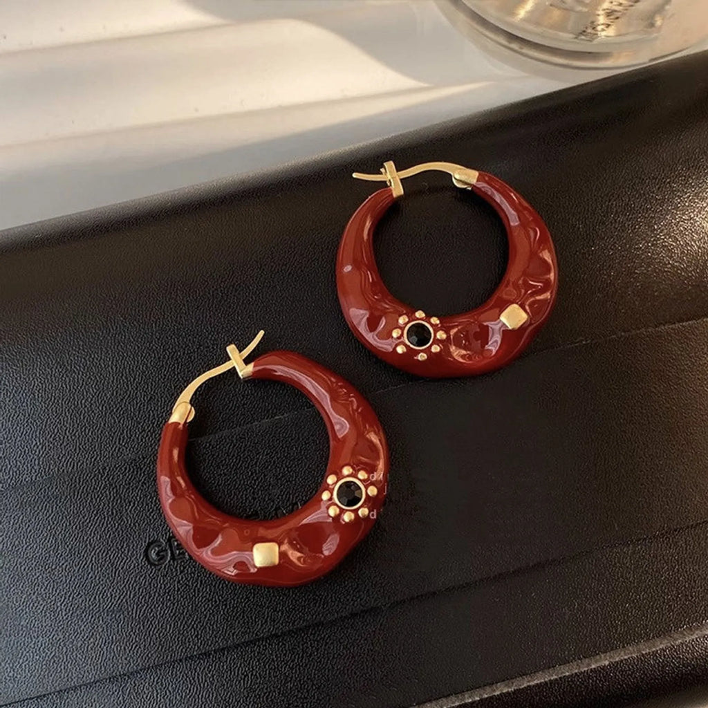 Retro Hong Kong style ear studs with rhinestone inlay and dripping oil textured finish in black and red colours
