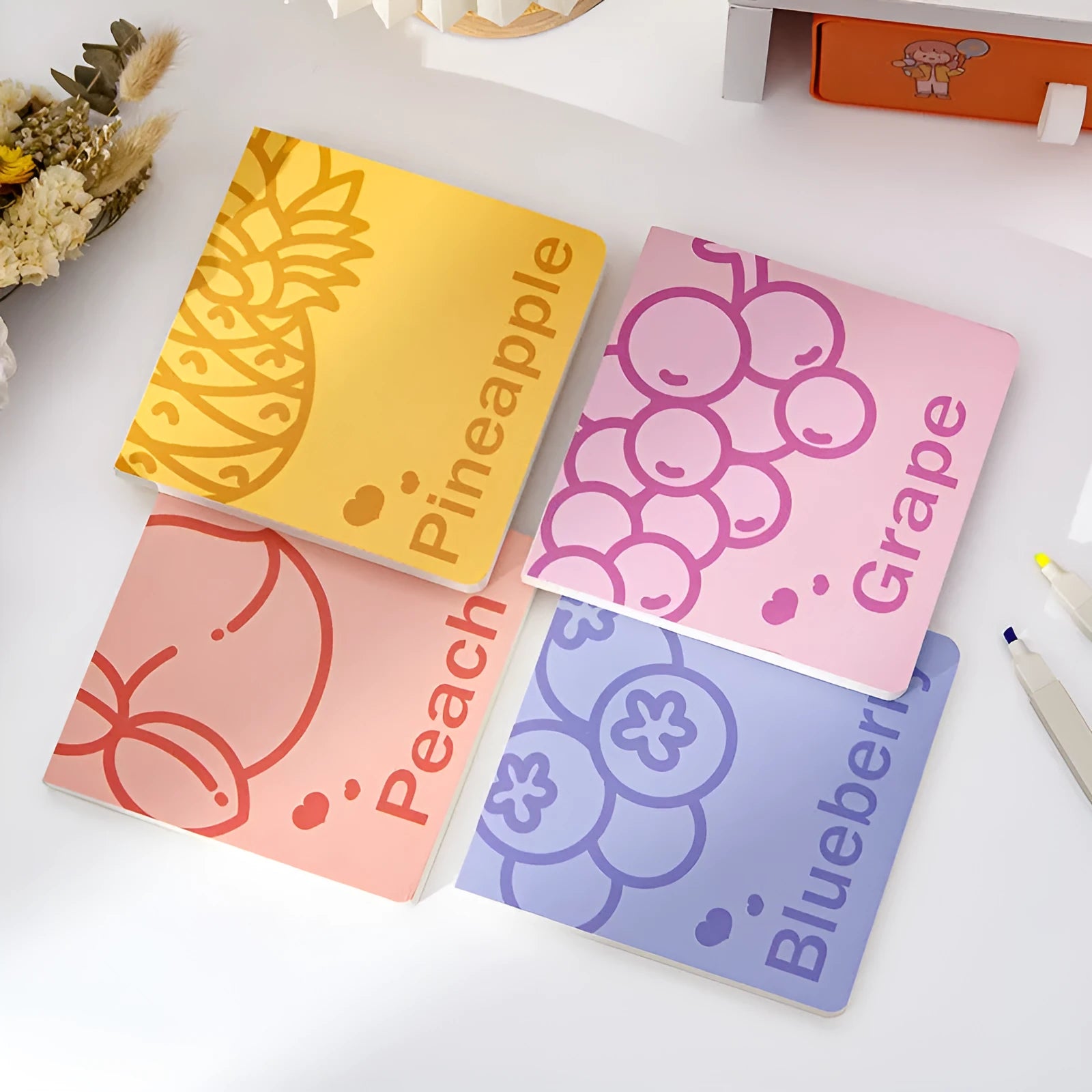 Square notebook with fruit embossed cover design showing 14.5cm dimensions