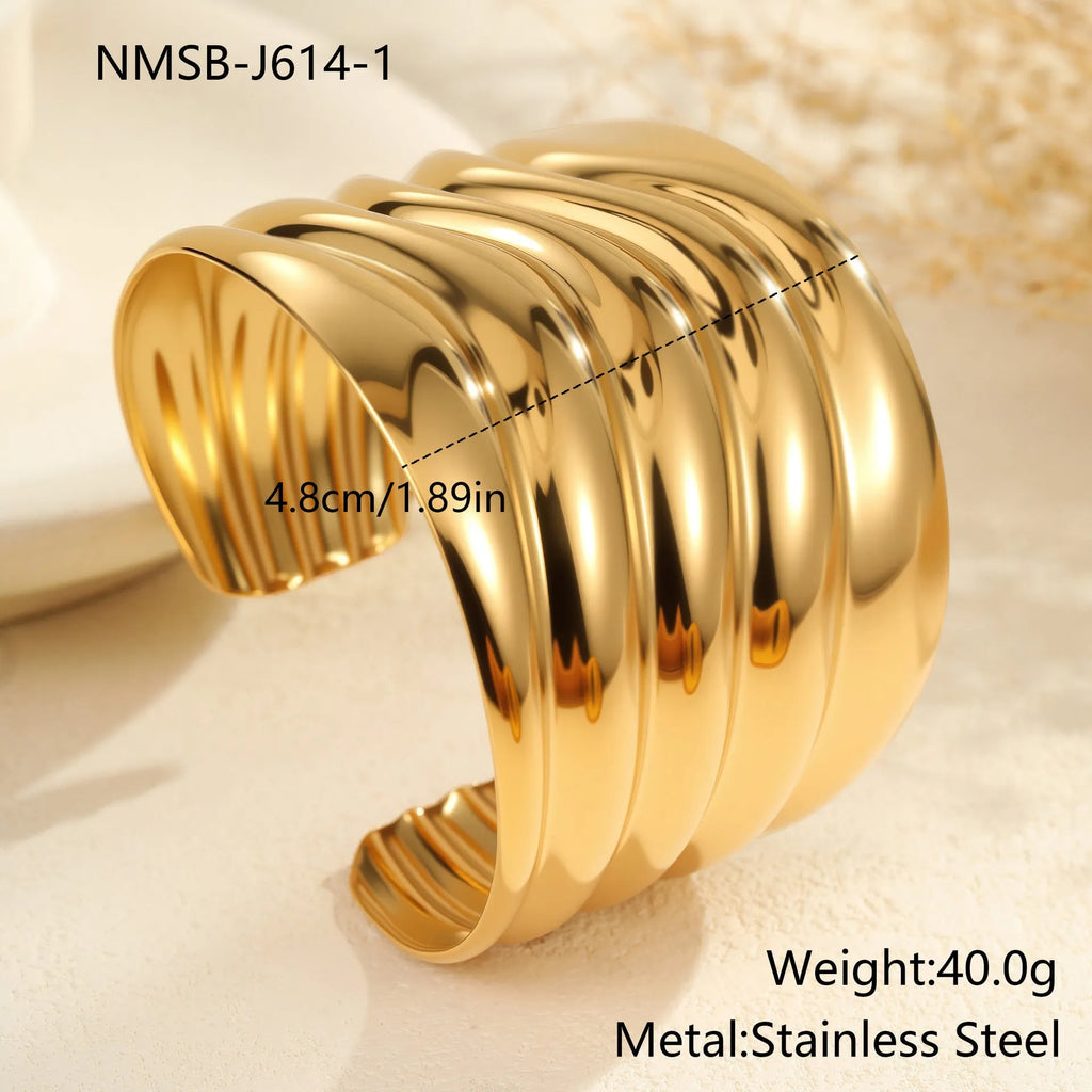 Women's wide wave design bracelet with geometric openings and gold plating finish