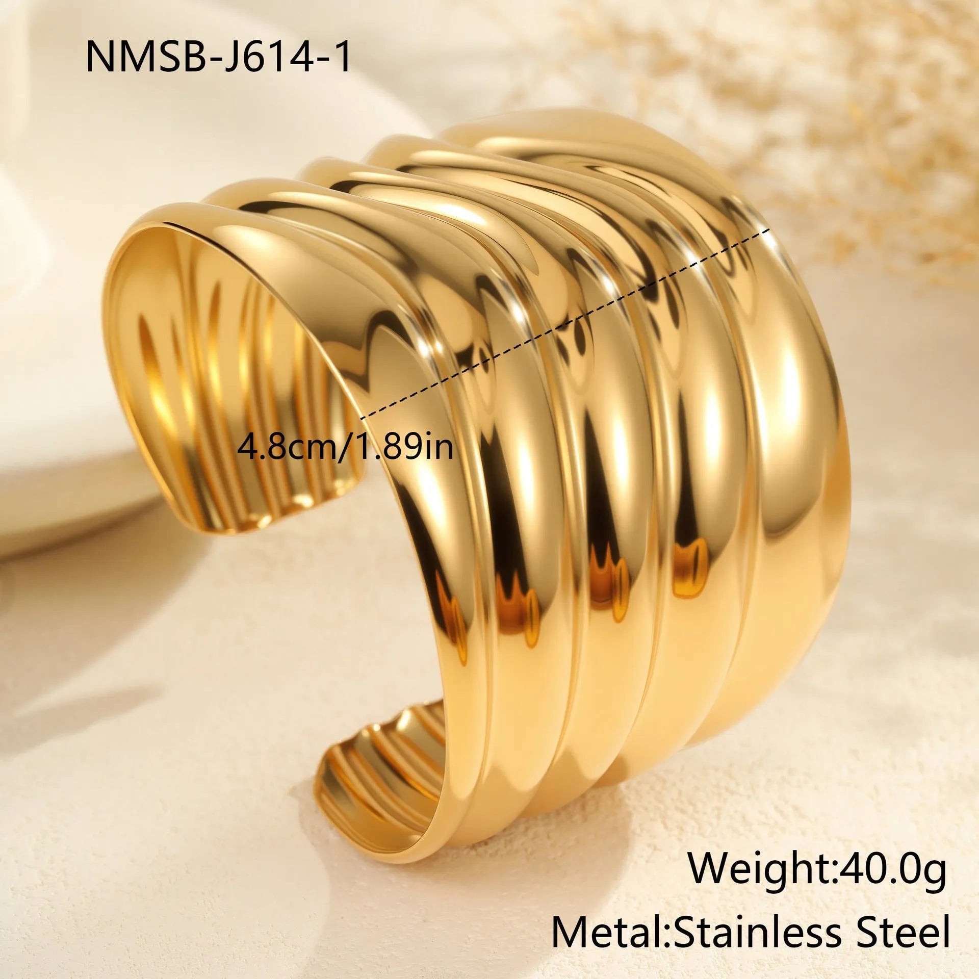 Women's wide wave design bracelet with geometric openings and gold plating finish