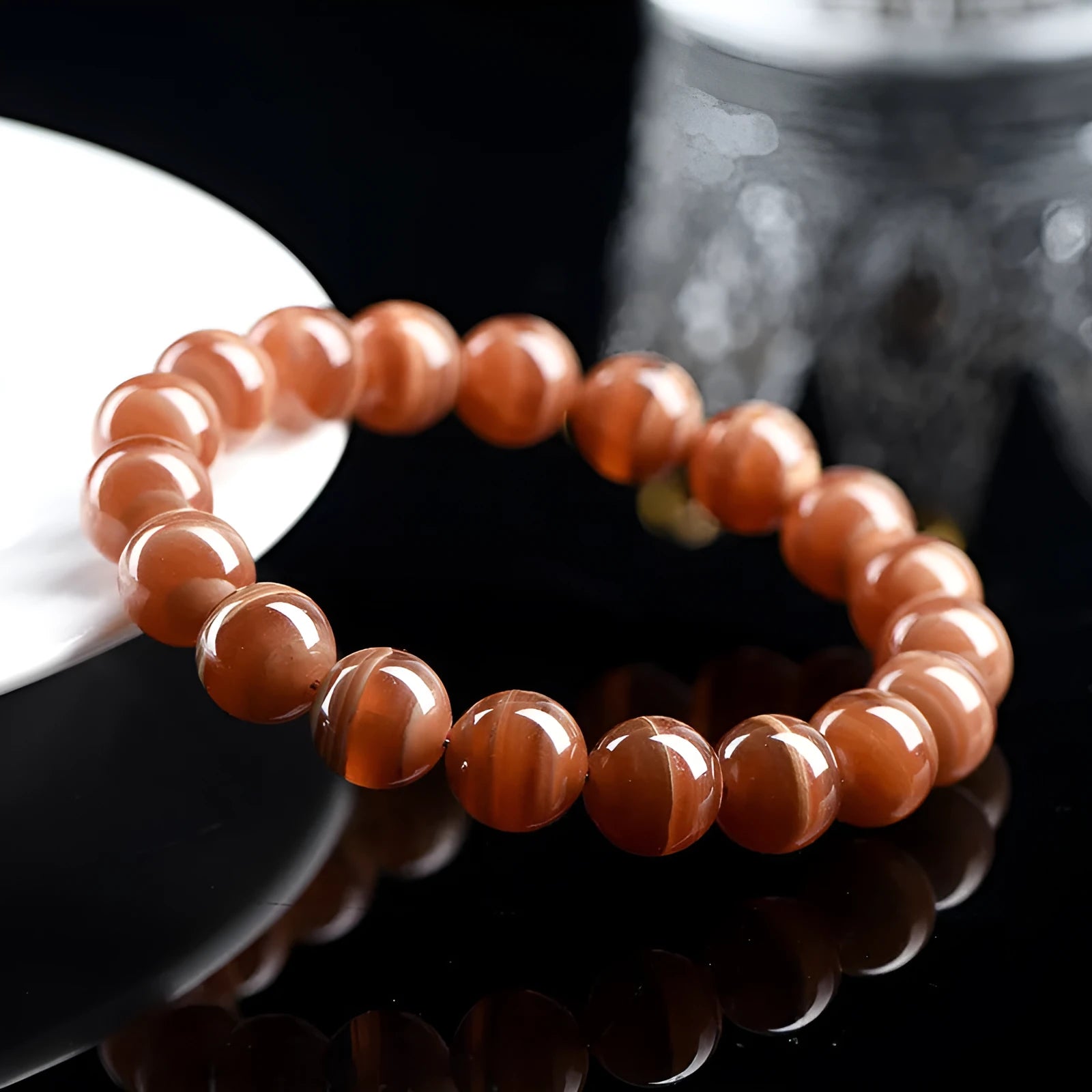 Natural old mine rhodochrosite round bead bracelet with Ruyi charm, Peruvian mineral jewellery.