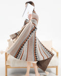 Acrylic sofa cover blanket with tassel trim in beige and orange colour.