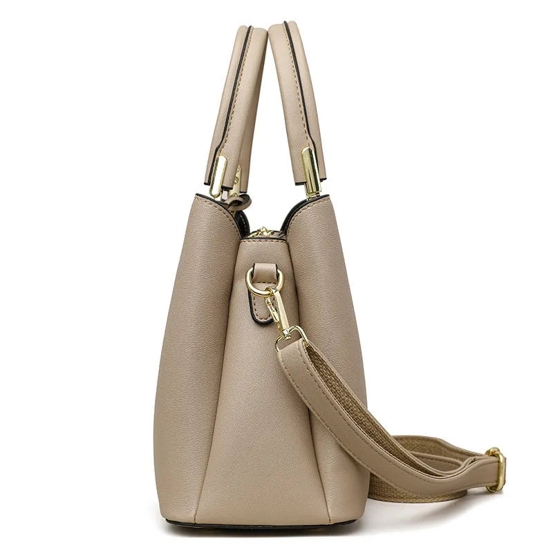 Black women's multi-layer shoulder messenger bag made from PU leather with sewing thread detail.