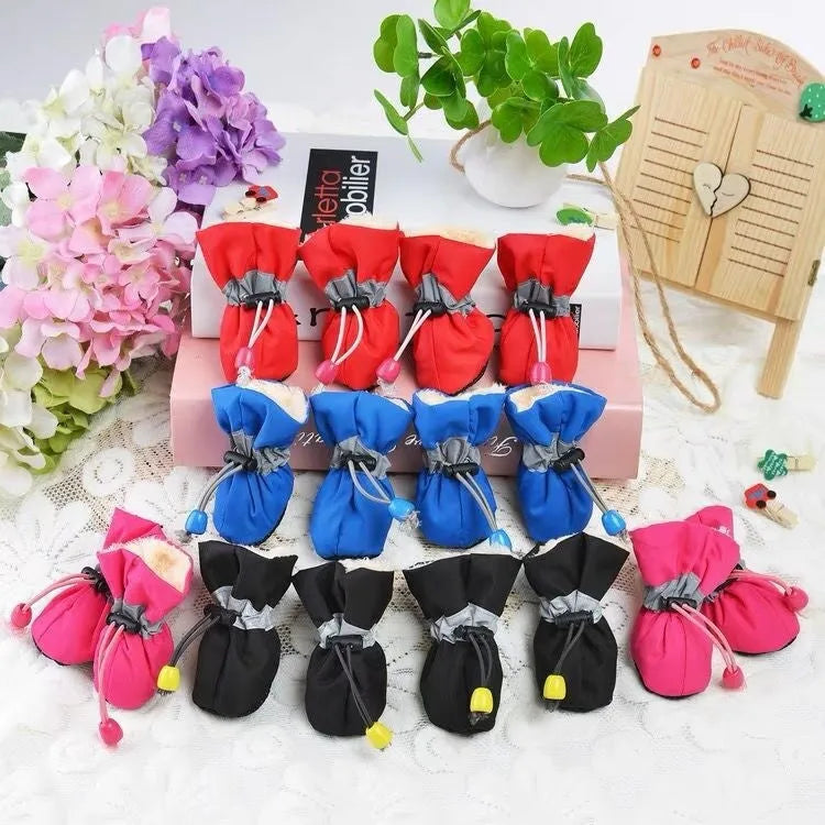 Set of four cloth dog shoes with soft soles in Rose Red colour showing non-slip bottoms