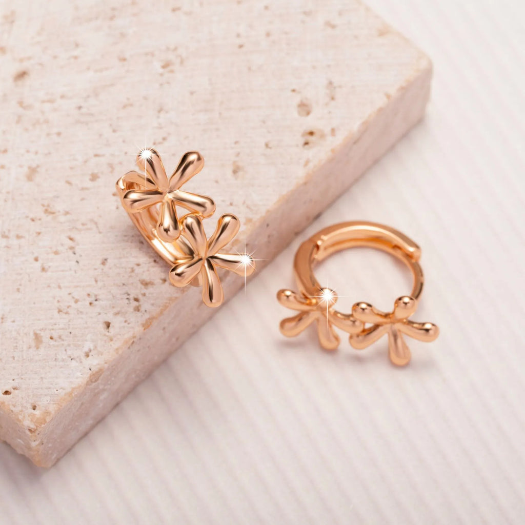 Circular rose gold electroplated earrings with waterdrop flower pattern for women