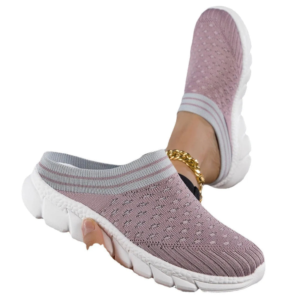 Black, pink, and purple striped Flyknit women's sports slippers with hollowed-out design on a viscose sole.