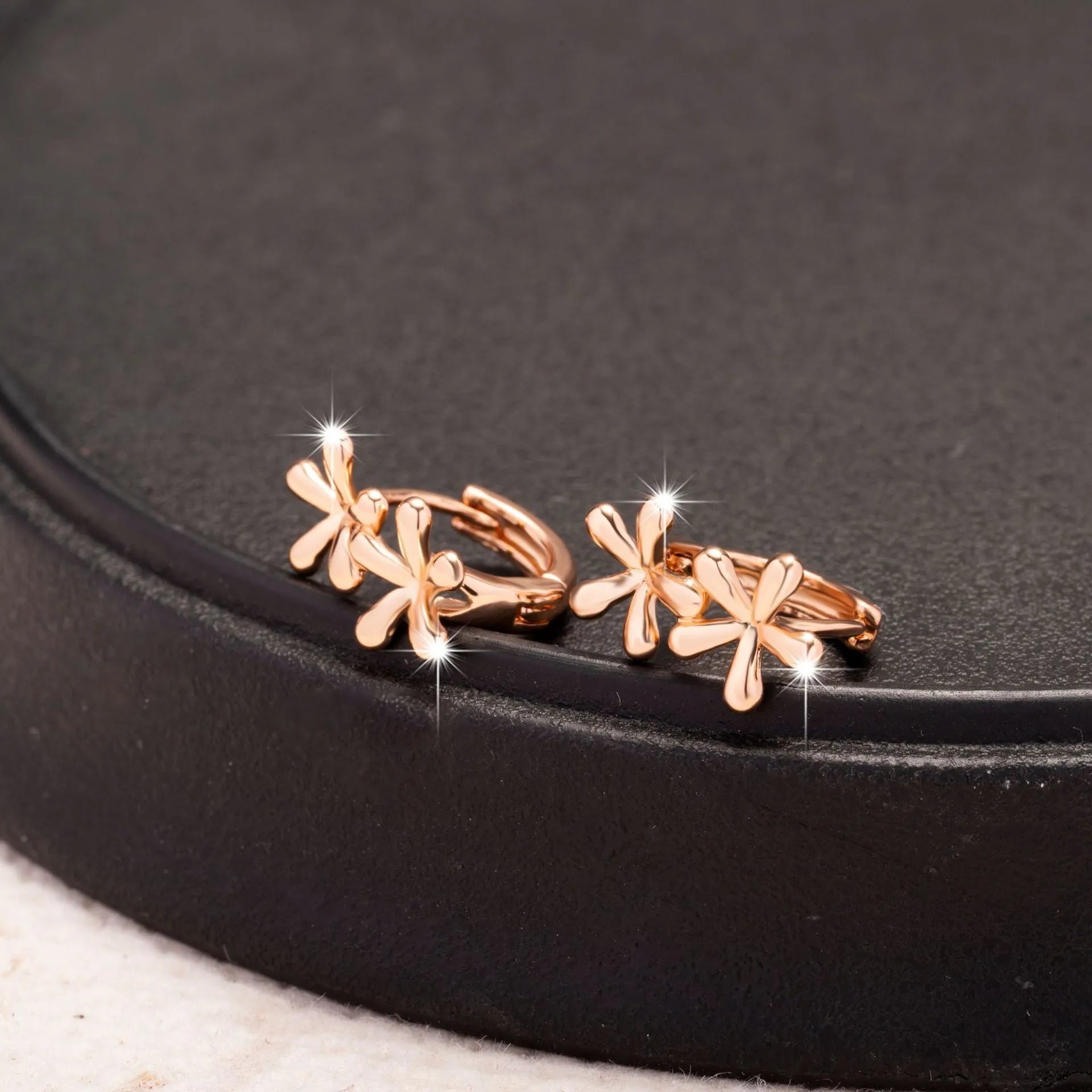 Circular rose gold electroplated earrings with waterdrop flower pattern for women