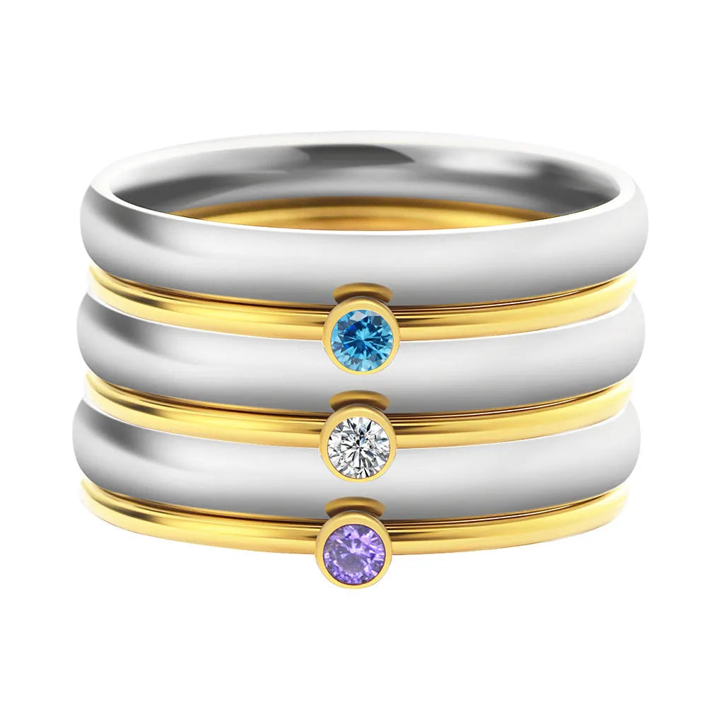 Close-up of a gold electroplated titanium steel ring with an engraved December birthstone geometric design.